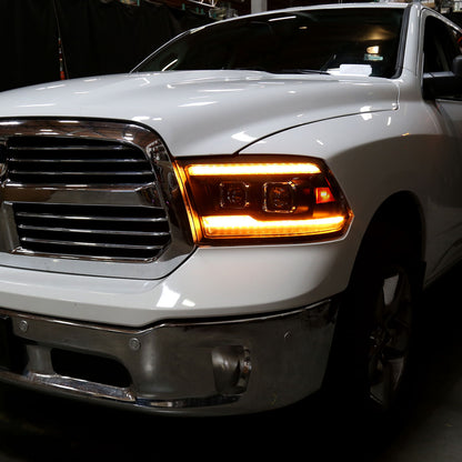 Ronnin - Fits 2009-2018 Ram 1500 2500 3500 2019-2024 Ram 1500 Classic Amber DRL Halogen Dual Projector Headlights LED Switchback Sequential Signal + Animated Startup Effect Assembly Pair | Black