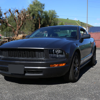 Ronnin - Se adapta a Ford Mustang 2005-2009, montaje de faros delanteros con proyector de halógeno LED de halo mejorado, par | Negro brillante