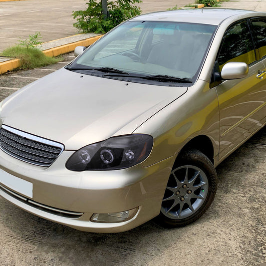 Ronnin - Fits 2003-2008 Toyota Corolla Upgraded Replacement  LED Dual Rims Projector Headlights Assembly Pair | Black Smoke