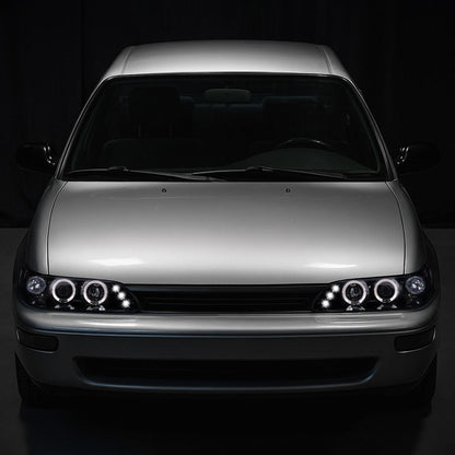 Ronnin - Se adapta a 1993-1997 Toyota Corolla Actualización de reemplazo LED con dos aros, faros delanteros con proyector, par | Humo Negro