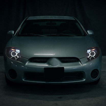 Ronnin - Compatible con Mitsubishi Eclipse 2006-2012, par de faros delanteros con proyector LED de doble aro mejorados | Negro humo