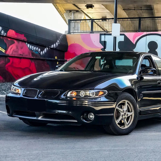 Ronnin - Fits 1997-2003 Pontiac Grand Prix All-in-One Replacement LED Dual Rims Projector Headlights + Corner Lights Assembly Pair | Black